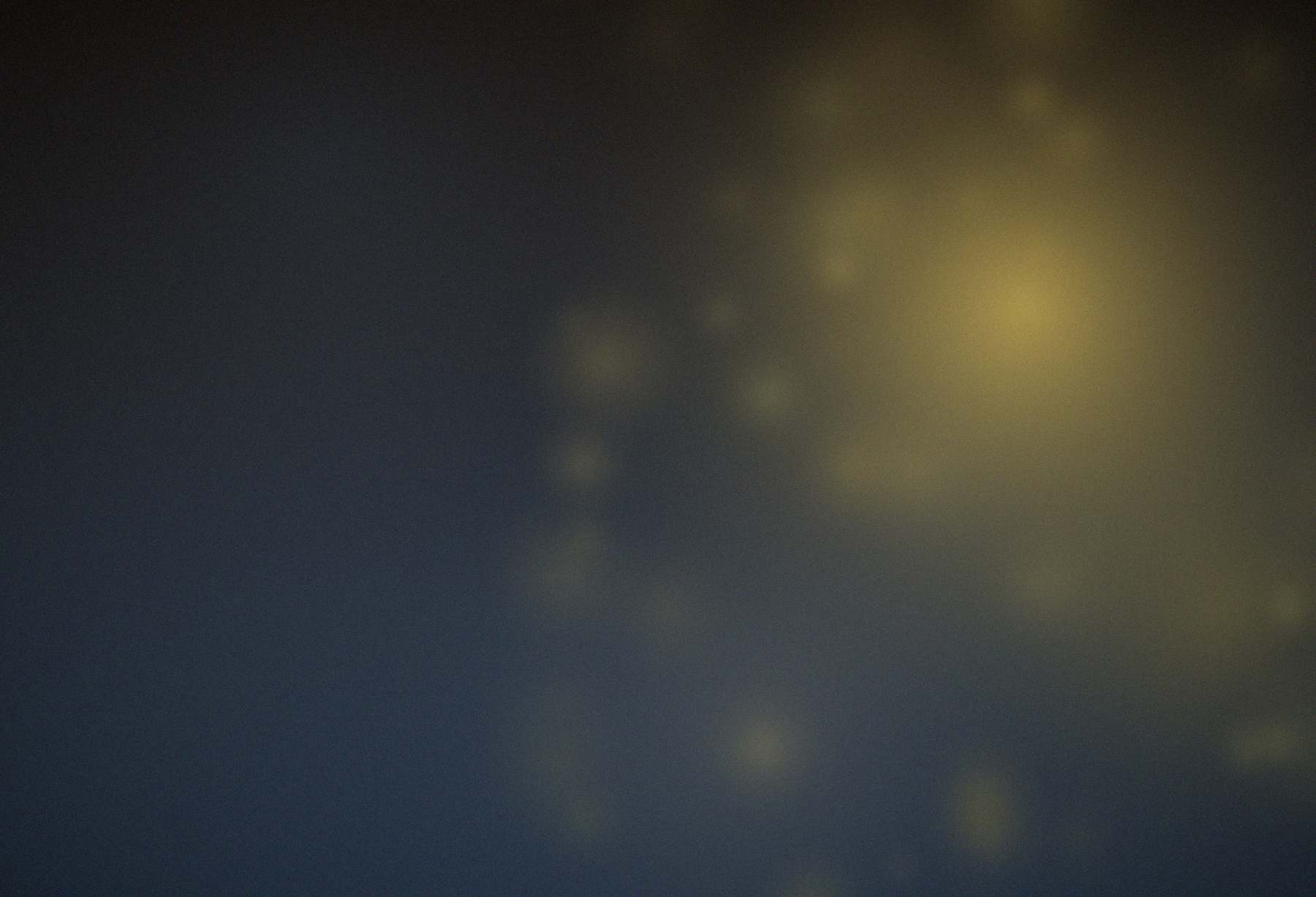 Warm light over a dark field - placeholder standing in for a photograph of Totomoxtle’s food.